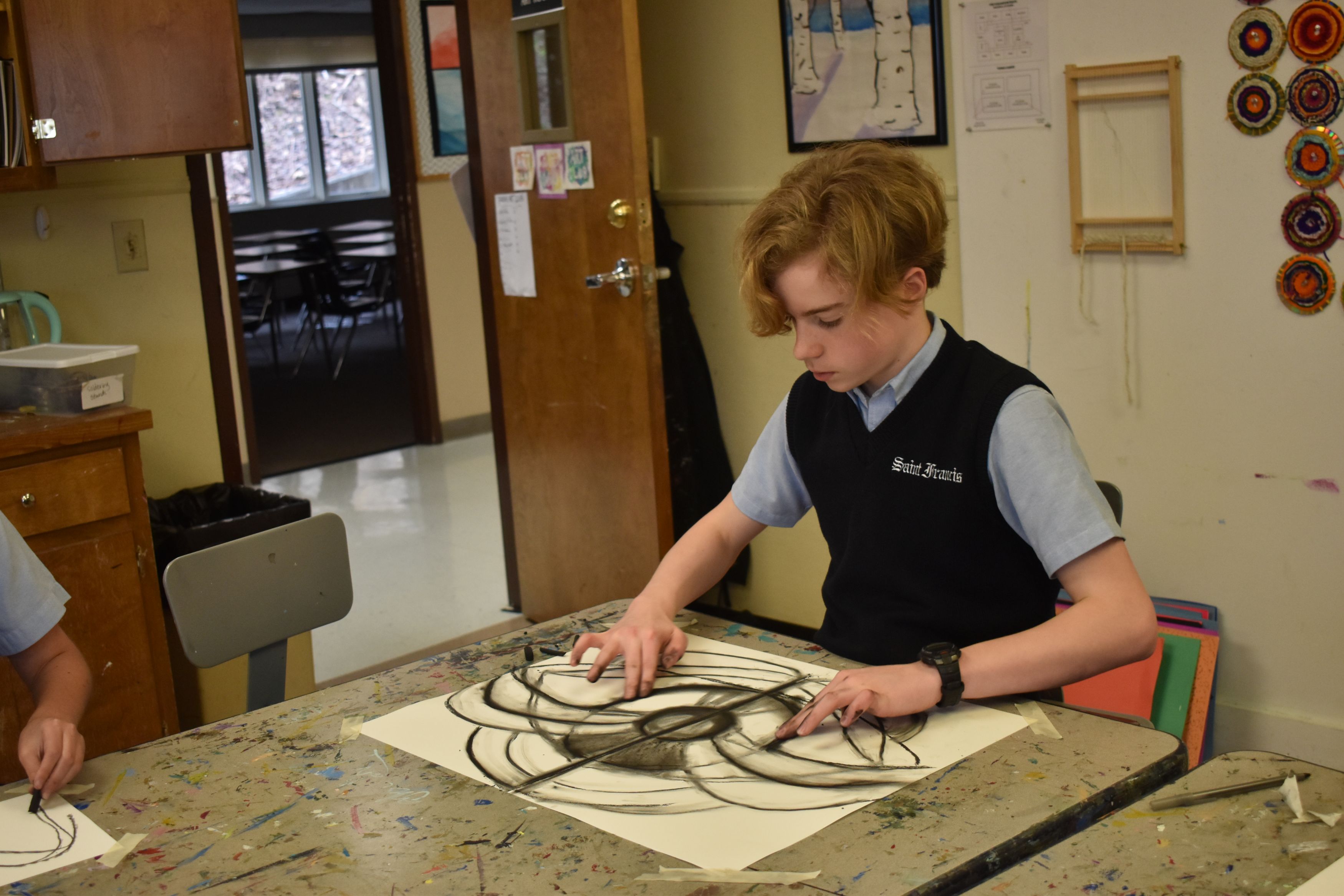 Middle School Student working on art for Middle School Parent Tours at Saint Francis School is Roswell, GA
