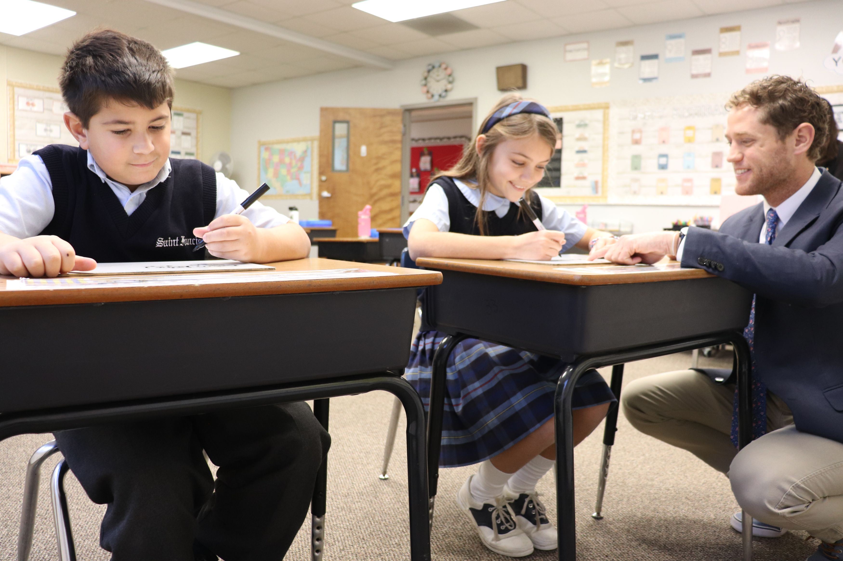Students getting individualized attention in the Just Words Reading program at Saint Francis School