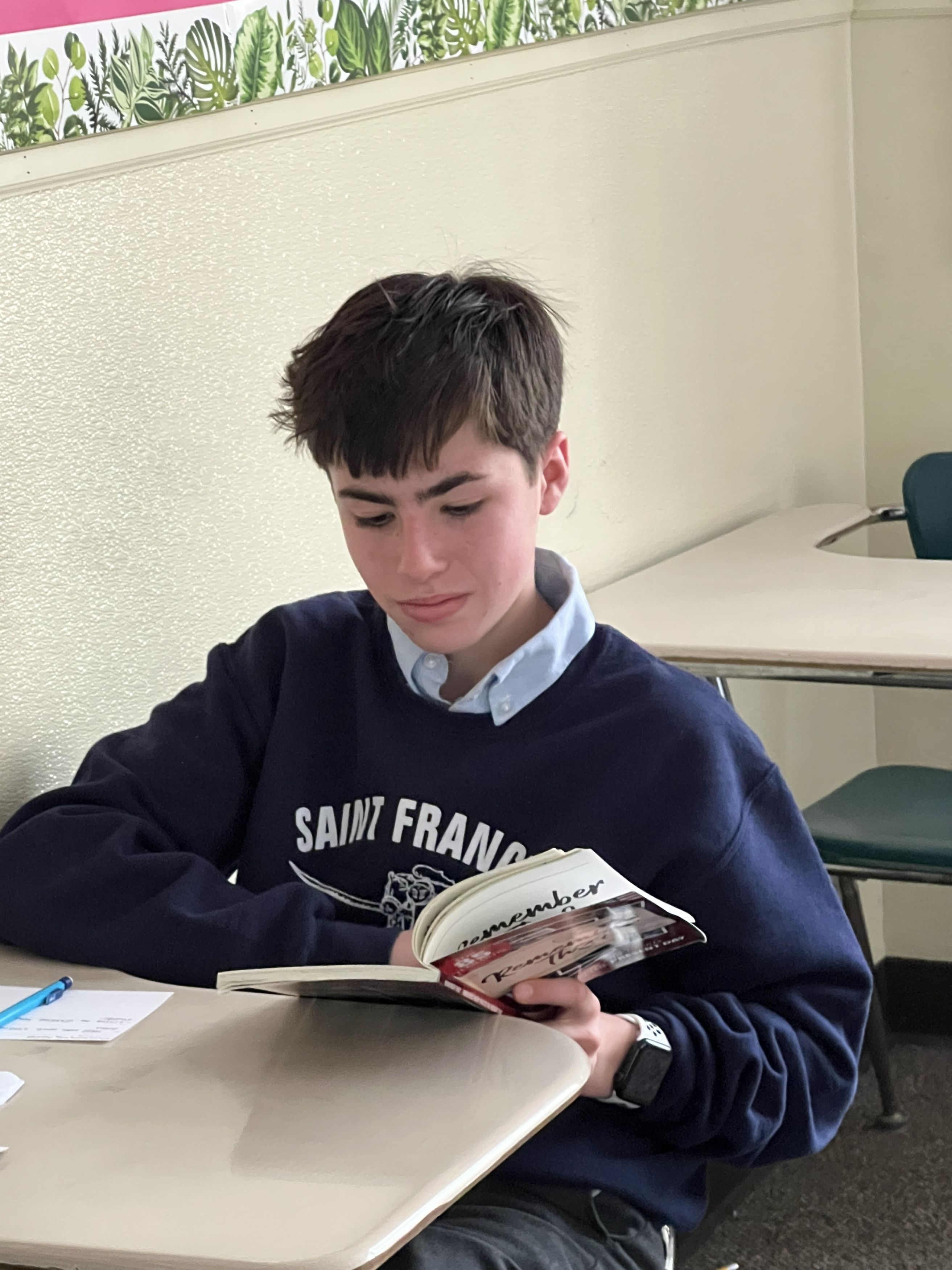 Saint Francis School Middle School Student Reading Book