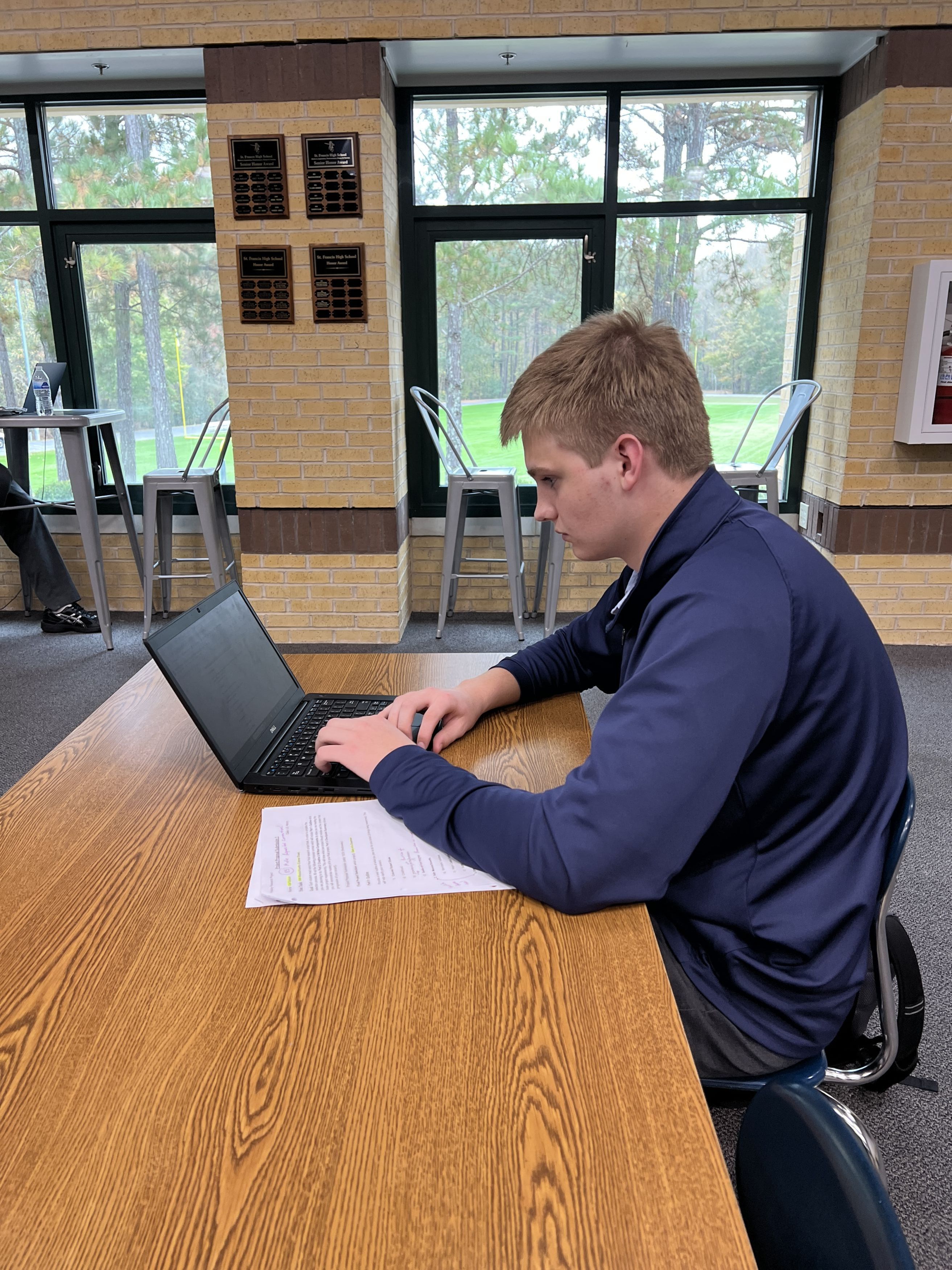 Student studing at the high school library