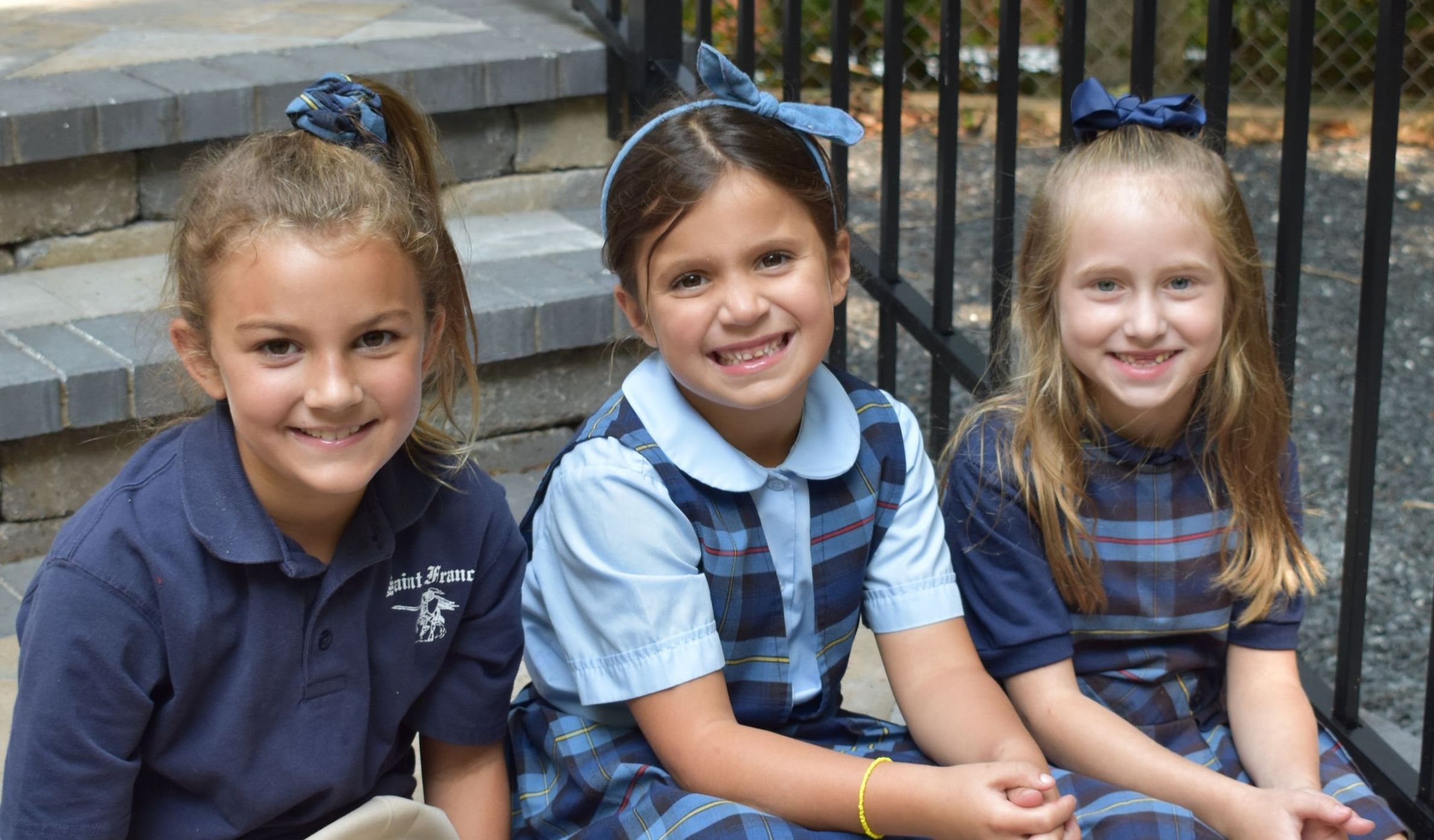 Saint Francis students sitting in the outdoor classroom